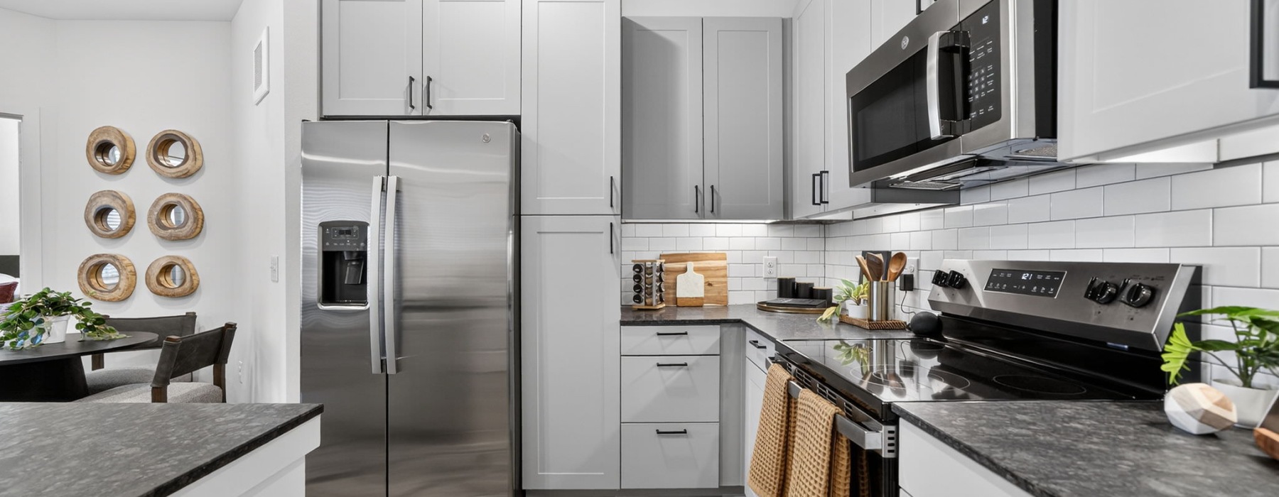 kitchen with stainless steel appliances and grey cupboards